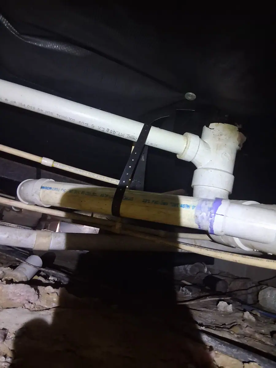 White drain lines strapped up under the belly wrap