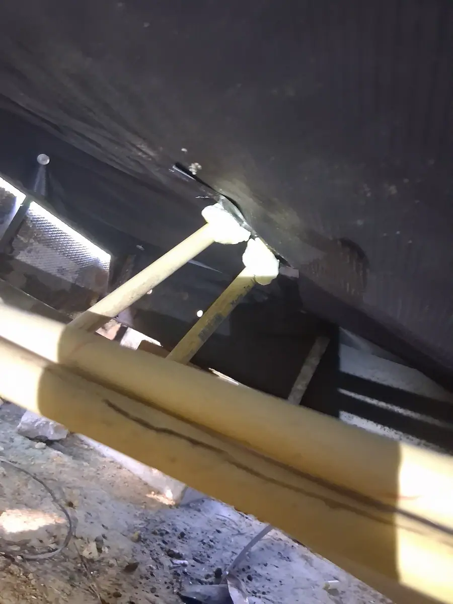 Water lines strapped up under black belly wrap