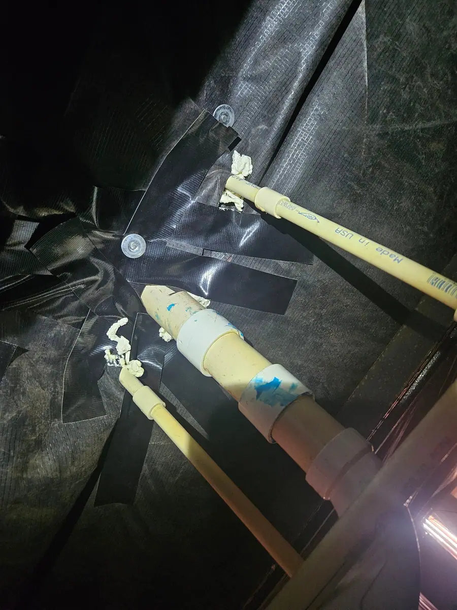 Plumbing penetrations taped and sealed at the new belly wrap